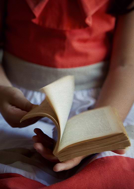Child with a book in hands