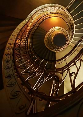 Spiral stairs in golden tones