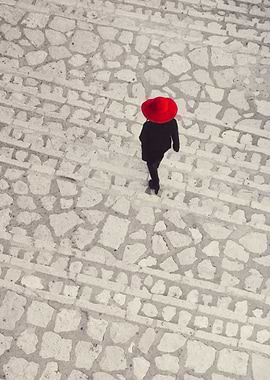 Woman in red hai in the stairs seeing from above