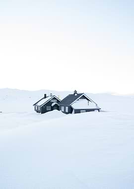 Snow covered cabin in the Norwegian mountains.