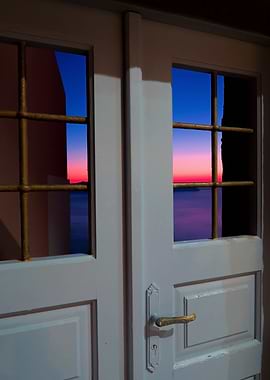 Sunset through the broken door