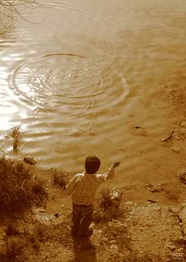 Child throwing pebbles