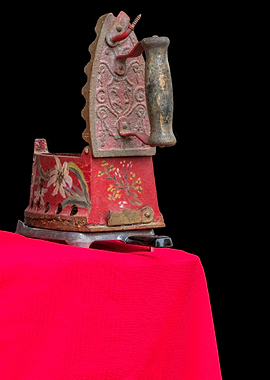 old iron on red carpet