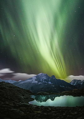 Green aurora and mountain