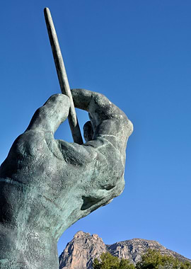Conductors hand with baton