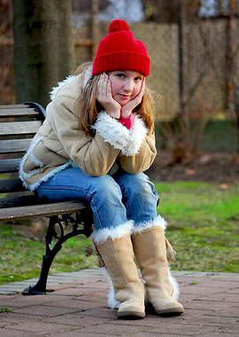 little girl on a bench