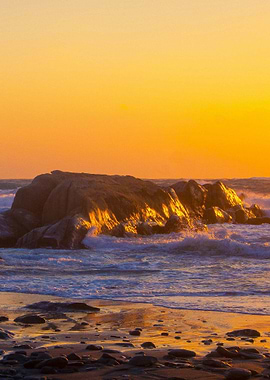 Yellow sunset on rocks
