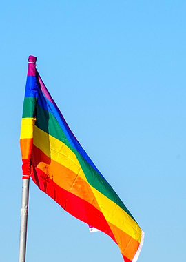 Gay rainbow flag blue sky