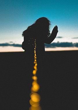 Woman holding lit lights