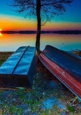 Boats On Lake Shore At Sun