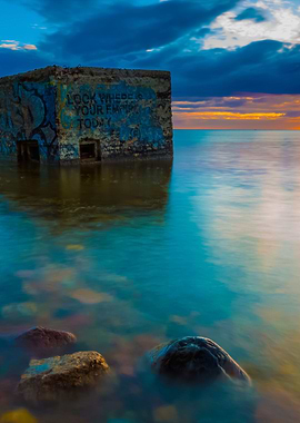 Rocky Sea Shore With Old B
