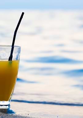Glass Of Cocktail On Beach