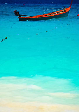 Red Boat On Beautiful Blue