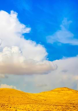 Desert With Cloudy Sky In
