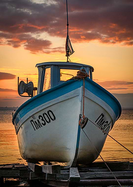 Fishing boat at sunset