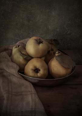 Silver bowl of quinces