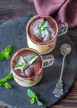 Two glass mugs of tiramisu