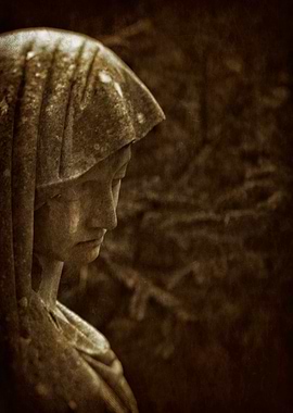 Grieving cemetery statue