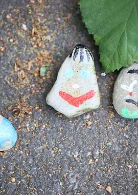 Kids drawing on stones