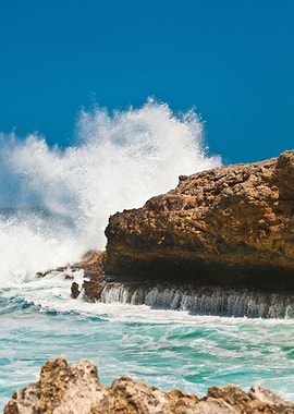 Coral Rock Crashing Waves