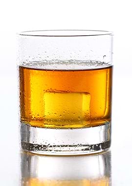 Gold whiskey on the rocks