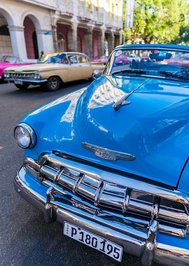 The front of a blue Chevy