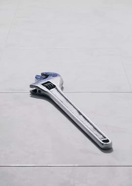 Wrench clean left on floor
