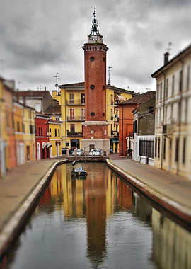 Tower at canal in Italy