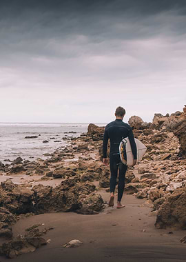 Surfer beach walking