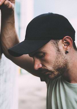 Leaning against a post