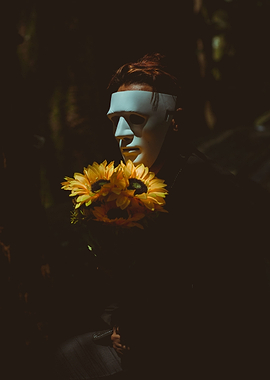 Mask behind the sunflowers