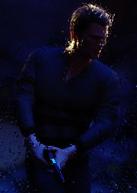 Man behind wet window