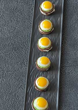 Canape with fried eggs