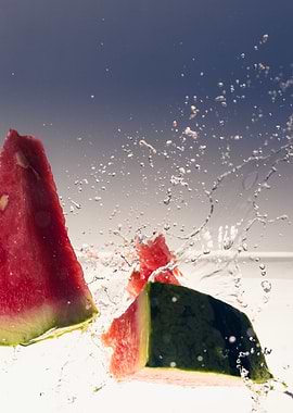 Watermelon falling into wa