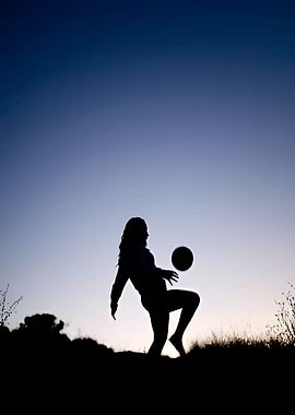 Silhouette of a Girl Playing Soccer
