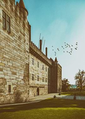 Guimaraes, Portugal. Palace of the Duques of Braganca. Medieval castle and museum of the Dukes of Braganza. Majestic stone castle with a towering facade constructed from rough-hewn stone blocks, giving it a weathered and ancient appearance.