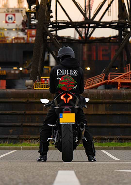 Motorcycle Rider in Industrial Setting on a cfmoto 450sr