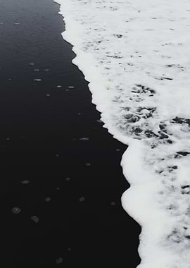 Black sand beach wave