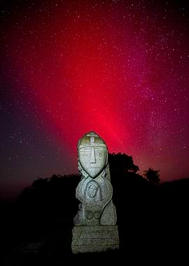 Statue Under Crimson Skies