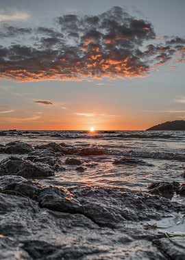 Sunset Over Rocky Shore