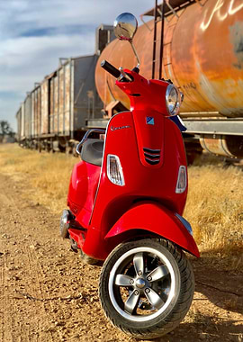 Red Vespa Scooter and cargo train