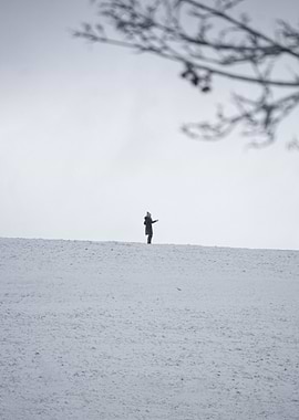 Solitary Figure in Snowy Landscape