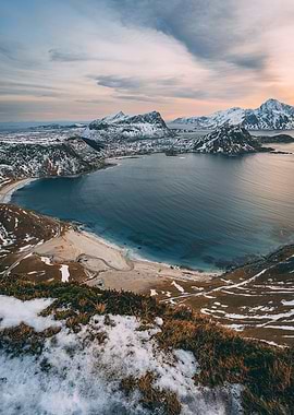 Dreamy Sunset at a Beach surrounded by snowy Mountains at Haukland