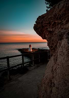 Coastal Sunset with Lighthouse