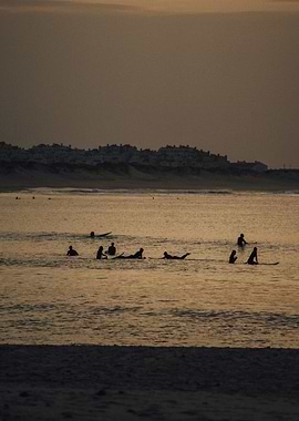Silhouettes of Surfers at Sunset in Baleal Portugal OU