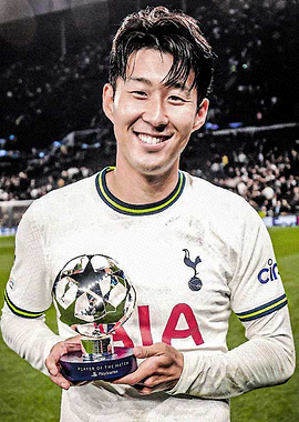Soccer Player Holding Trophy