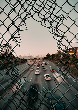 Cityscape Through Fence