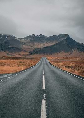 Empty Road Through Mountains