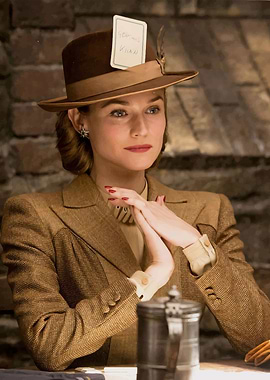 Woman in Brown Suit and Hat