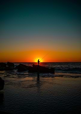 Silhouette of Fisherman at Sunset